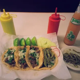 Steak tacos with grilled cactus and onion