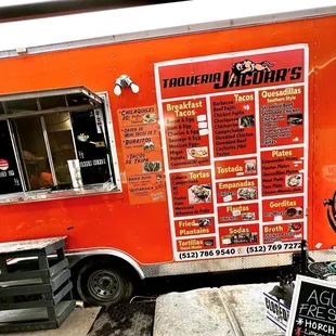 a food truck with menus