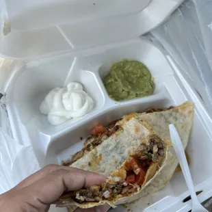 a person holding a tortilla