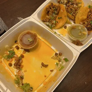 Al Pastor oil bath with a sprinkle of cilantro and onions.