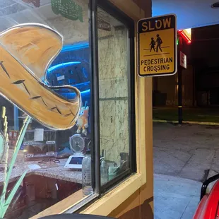 Drive through crossing caution sign.