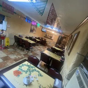 Tables from an Asian buffet are an interesting choice when so much has been done to create a consistent theme in here.