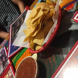 a bowl of chips and a bowl of salsa
