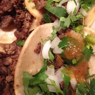 Smothered in cilantro, onions, salsa, and lime because taco.