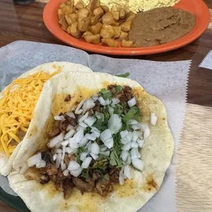 Migas Plato and bean/cheese taco and pastor taco