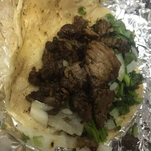 Carne asada with onion and cilantro. Best lunch taco I&apos;ve had so far!