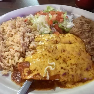 Beef enchiladas with rice, beans &amp; salad