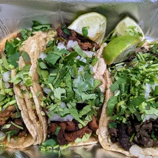 2 Pastor Tacos (left) and 1 Asada Taco (right). Full of meat, limes for each, plenty of onion/cilantro. DELICIOUS!