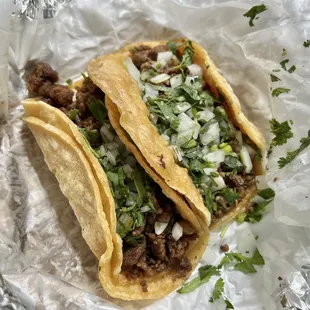 two tacos on tin foil