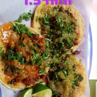 2 tacos de asad with green salsa 1 taco de chorizo with red salsa