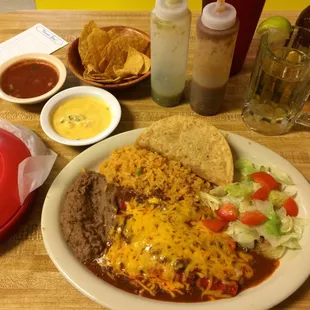 Combo plate: one crispy beef taco and two cheese enchiladas. Free chips, salsa, queso and tortillas.