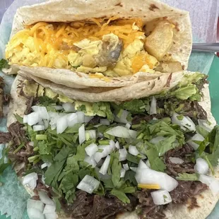 Potato and egg with cheese taco, and a Barbacoa taco