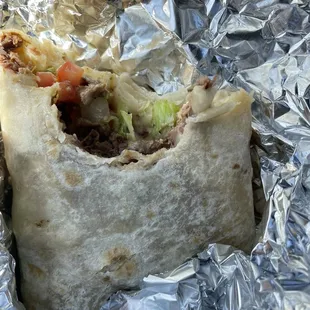 a burrito wrapped in tin foil