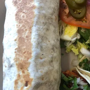 Burrito of asada. So much flavor in this thing. It is filled with carne asada, beans, cabbage and pico de gallo.
