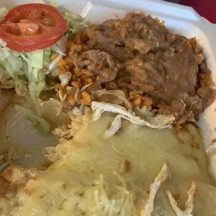 (Enchiladas Platillo) bien relleno de pollo. They don't skimp on the chicken. Buen sabor. Good flavor.