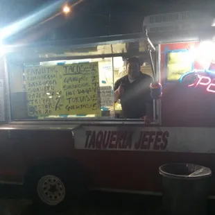 a man behind a food truck