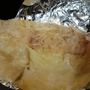 a piece of food wrapped in foil