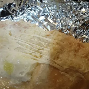 a piece of food wrapped in foil