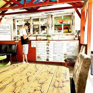 a woman standing in front of the counter