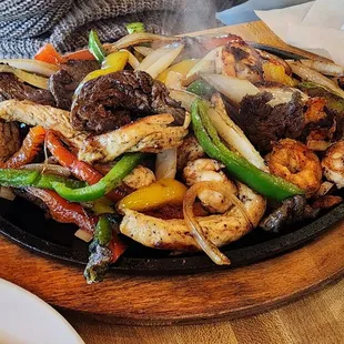 Jessy's Fajitas: shrimp, chicken &amp; beef fajitas mixed with bell peppers &amp; onions
