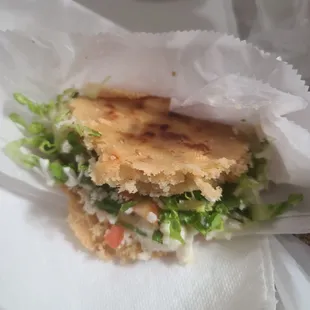 a close up of a taqueria sandwich