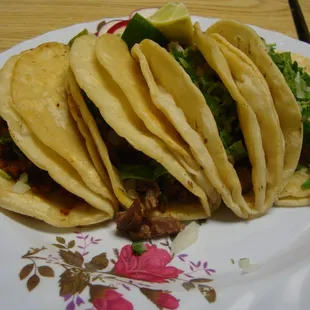 Carne asada, lengua, tripa, chorizo tacos.