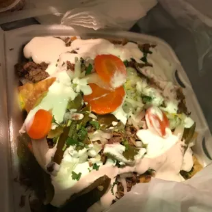 a taqueria in a plastic container