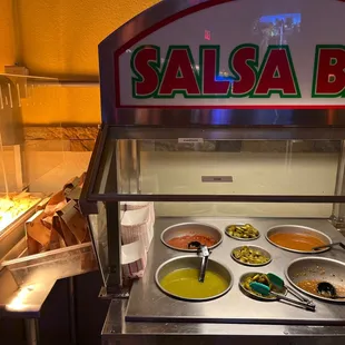 Chips and Salsa bar -All four sauces are are made different have different spice levels.