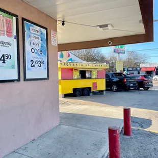 a taqueria truck parked in front of a building