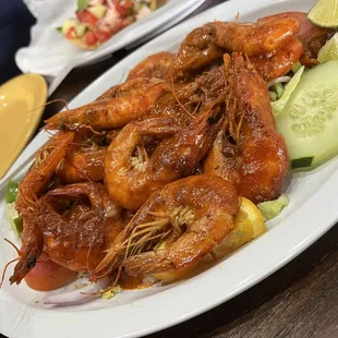 a large platter of cooked shrimp