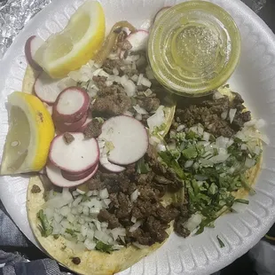 4 tacos with everything jalapeños and grilled onions on the side