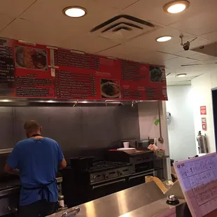 The stove is right by the counter so you can see the food being prepared