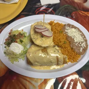 Steak chimichanga with rice and refried beans