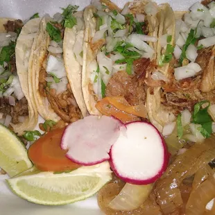 Asada, al pastor, and two carnitas tacos.