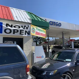 cars parked in front of a taqueria