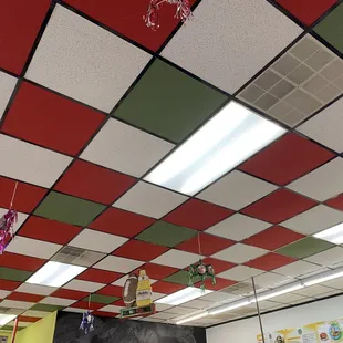 a classroom with colorful ceiling tiles