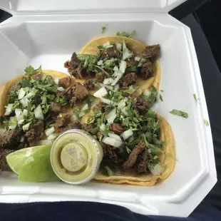 a close up of a taco in a styrofoam container
