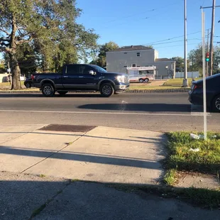 a pickup truck driving down a street