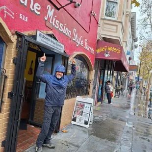 a man standing in front of a building