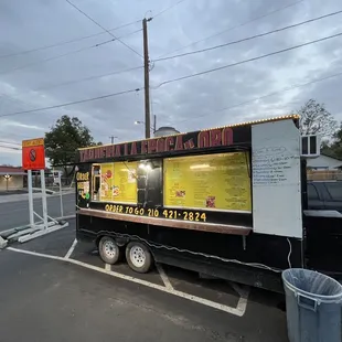 a taqueria truck parked in a parking lot
