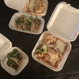 Two carne asada tacos, three chicken tacos combo with rice and beans, and two chicken enchiladas combo with rice and beans