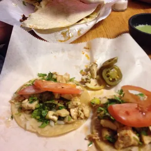 Sincronizada in the back. Chicken tacos with stolen tomatoes from the Sincronizada