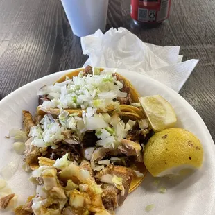 Carnitas tacos with funny limes/lemon