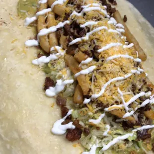 Cali Burrito  Meat, Guacamole, Lettuce, Cheese, Beans, Rice, Fries, and Sour Cream