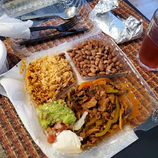 Bistec ranchera with rice and beans.