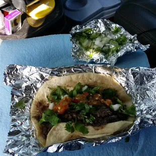 two tacos in tin foil