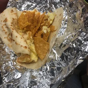 "Migas taco" or just scrambled eggs with a few crumbled up tortilla chips