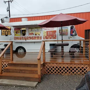 a taqueria truck parked in front of a restaurant