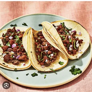 three tacos on a plate