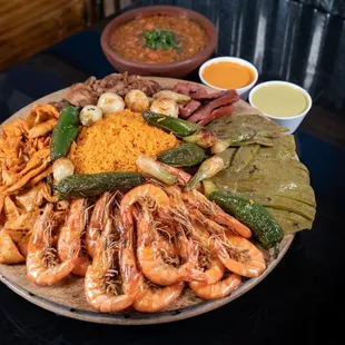 a platter of seafood and rice